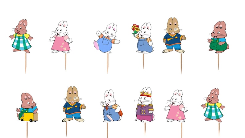 May include: A set of twelve decorative cupcake toppers featuring cartoon rabbit characters in various outfits, including dresses, overalls, and a royal costume, each attached to a thin wooden pick for insertion into food items.