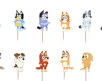 May include: A set of twelve decorative cupcake toppers featuring various cartoon dog characters in shades of blue, orange, yellow, and white. Each character is printed on cardstock and attached to a thin, pointed wooden toothpick for insertion.