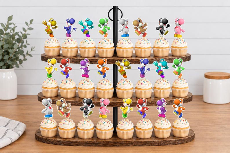 May include: A three-tiered wooden cupcake stand holding twenty-four cupcakes, each topped with a colourful Yoshi character cutout. The Yoshi figures appear in various colours including yellow, blue, green, white, brown, black, pink, orange, and red.