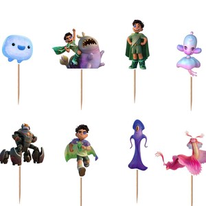 May include: A set of twelve decorative cupcake toppers featuring various animated characters and creatures in vibrant colours, each mounted on a thin wooden toothpick. The collection includes human figures, a blue blob, and several fantastical beings.