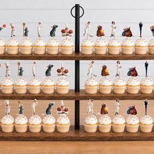 May include: A three-tiered wooden cupcake stand holding thirty-six cupcakes, each topped with a small paper cutout of a character from the movie Ratatouille. The cupcakes feature white frosting with colorful sprinkles and are arranged in three rows.