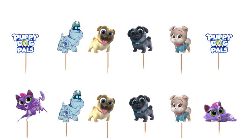 Puede incluir: Un conjunto de adornos para cupcakes de Puppy Dog Pals con personajes de dibujos animados, incluyendo un perro robot azul claro, un pug beige, un pug negro, un cachorro marr&oacute;n claro y un gato morado, unidos a palillos de madera finos.
