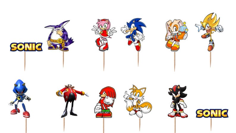 May include: A set of twelve decorative cupcake toppers featuring various Sonic the Hedgehog characters including Big the Cat, Amy Rose, Sonic, Cream the Rabbit, Super Sonic, Metal Sonic, Dr. Eggman, Knuckles, Tails, and Shadow, plus two SONIC logos.