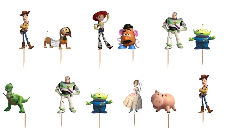 May include: A set of twelve decorative cupcake toppers featuring various animated characters including a cowboy, a cowgirl, a space ranger, a green dinosaur, a pig, a potato-shaped figure, a shepherdess, a dog with a spring body, and aliens.
