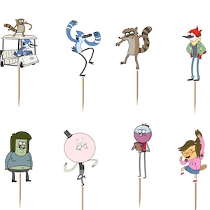 May include: A collection of cartoon character cupcake toppers featuring characters from the animated series Regular Show. Each topper is a colorful illustration of a character attached to a wooden pick, perfect for themed parties or celebrations.
