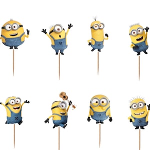 May include: A set of twelve yellow Minion cupcake toppers, each featuring a different character pose and expression, attached to thin wooden picks. The characters are wearing blue denim overalls and silver goggles, displayed against a white background.