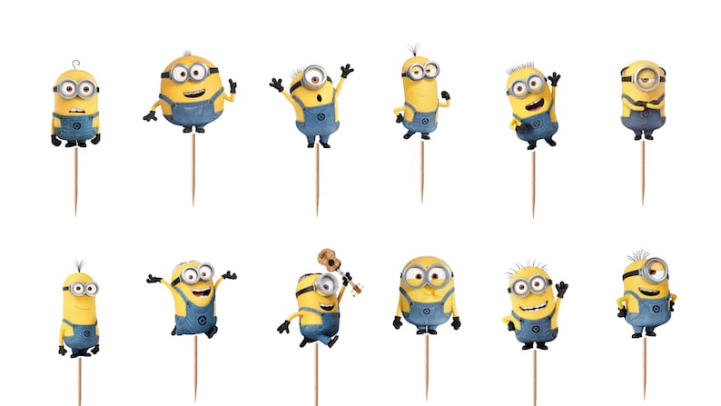 May include: A set of twelve yellow Minion cupcake toppers, each featuring a different character pose and expression, attached to thin wooden picks. The characters are wearing blue denim overalls and silver goggles, displayed against a white background.