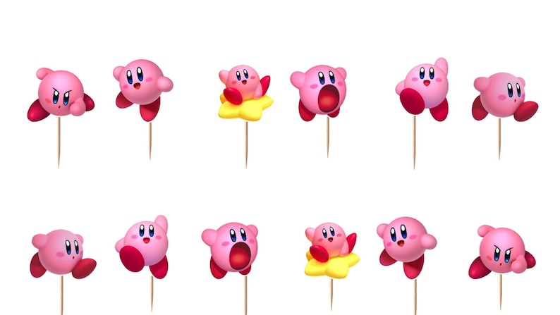 May include: A set of twelve pink Kirby character cupcake toppers, each attached to a thin wooden pick. The figures display various expressions and poses, including some riding yellow stars, with round bodies, red feet, and blue eyes.