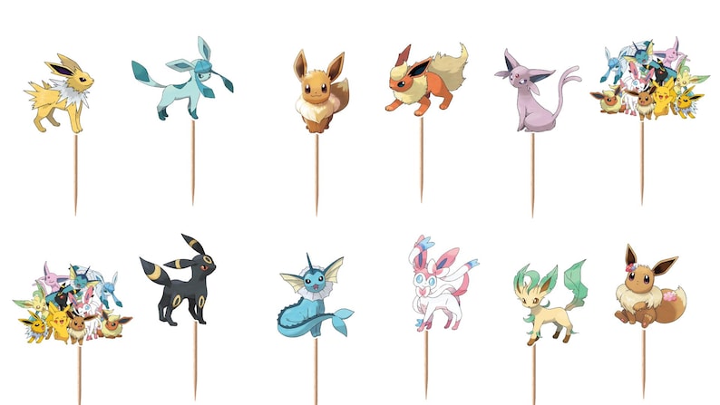 May include: A set of twelve decorative cupcake toppers featuring various colorful cartoon creatures, including Eevee and its evolutions. Each topper consists of a printed character image attached to a thin, light brown wooden toothpick stick.