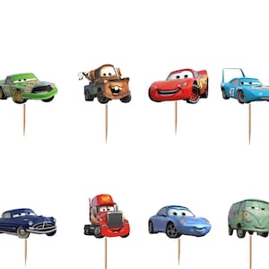 May include: A set of twelve decorative cupcake toppers featuring various animated car characters from the movie Cars. Each character is printed on cardstock and attached to a thin wooden toothpick, including red, blue, green, and brown vehicles.