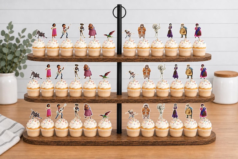 May include: A three-tiered wooden cupcake stand holding rows of cupcakes topped with various character cutouts. The toppers feature colourful illustrations of people, a dog, and a bird, arranged in repeating patterns across the three levels.