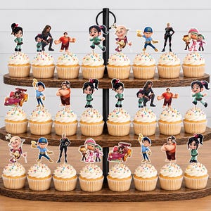 May include: A three-tiered wooden cupcake stand holding twenty-four cupcakes, each topped with a colorful paper cutout featuring characters from the Wreck-It Ralph movie franchise, including Ralph, Vanellope, and Felix, with rainbow sprinkles.