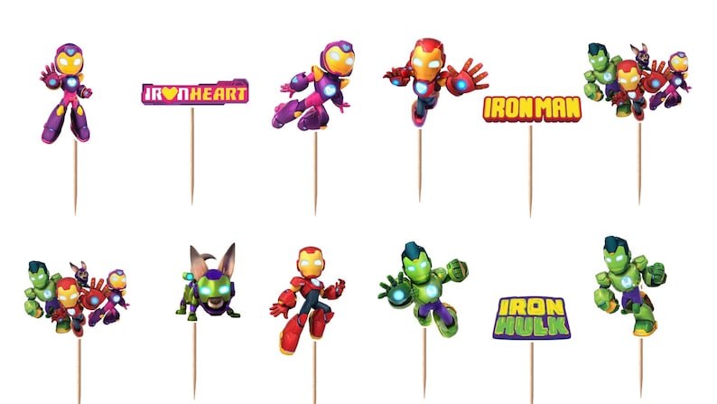 May include: A set of decorative cupcake toppers featuring various superhero characters in red, gold, purple, and green armor, along with rectangular signs displaying the text IRONHEART, IRONMAN, and IRON HULK, all attached to thin wooden sticks.