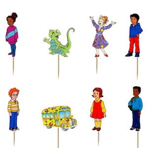 May include: A set of twelve decorative cupcake toppers featuring colorful illustrations of children, a green lizard, and yellow school buses. Each character and vehicle is attached to a thin wooden pick, designed for placement on food items.