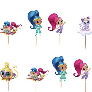 May include: A set of decorative cupcake toppers featuring Shimmer and Shine characters, including genies with blue and pink hair, a purple cat, and a yellow monkey, all attached to wooden picks with teal-bordered Shimmer and Shine logo signs.