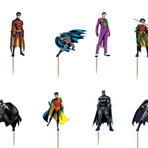 May include: A set of twelve decorative cupcake toppers featuring various comic book characters including Batman, Robin, and the Joker, each attached to a wooden toothpick. The collection includes two yellow and black bat logos and ten character figures.