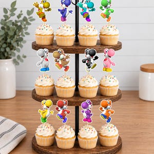 May include: A three-tiered wooden cupcake stand holding twelve cupcakes, each topped with a colourful Yoshi character cutout. The cupcakes feature white frosting with multi-coloured sprinkles, and the Yoshi figures appear in yellow, blue, teal, green, white, brown, black, pink, red, purple, and orange.