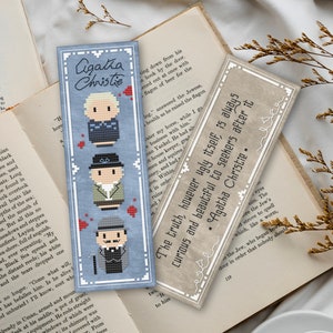 May include: Three blue bookmarks with cross-stitch designs featuring Agatha Christie characters. The bookmarks have white borders and the text "Agatha Christie" and "The truth, however ugly itself, is always curious and beautiful to seekers after it."