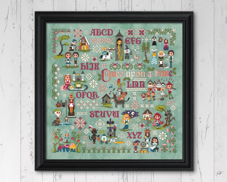 cross stitch pattern of Grimm's Fairy Tales stitched with DMC thread on aqua aida