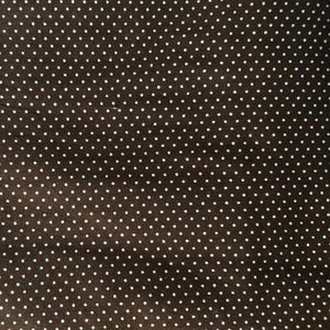 May include: Brown fabric with a white polka dot pattern.