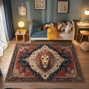 May include: A rectangular area rug with a lion's face in the center. The rug has a red, navy, and cream color scheme with an ornate, traditional design. The lion's mane is a warm brown color.