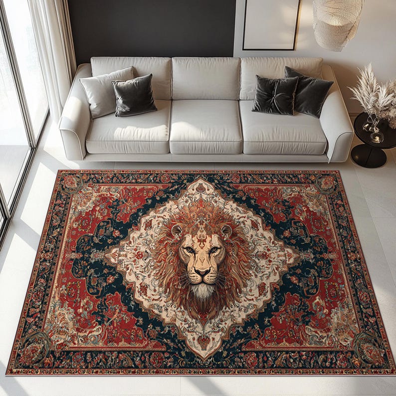 May include: A rectangular area rug with a central lion's head design. The rug features a red, navy blue, and cream color palette with an ornate, traditional pattern. The lion's face is detailed with brown and tan hues.