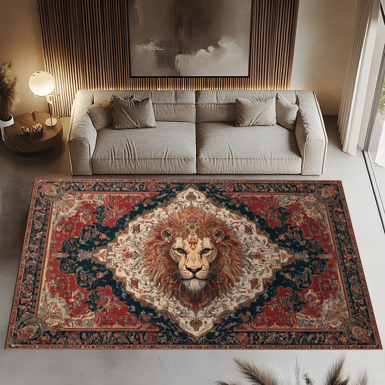 May include: A rectangular area rug with a detailed lion's face in the center. The rug features a red and navy blue border with an ornate floral design. The lion's mane is a warm orange color.