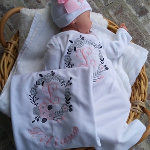 Baby Girl Coming Home outfit with options.  Beautifully embroidered floral wreath with initial, name on beanie, and blanket with wreath, initial and name under wreath.