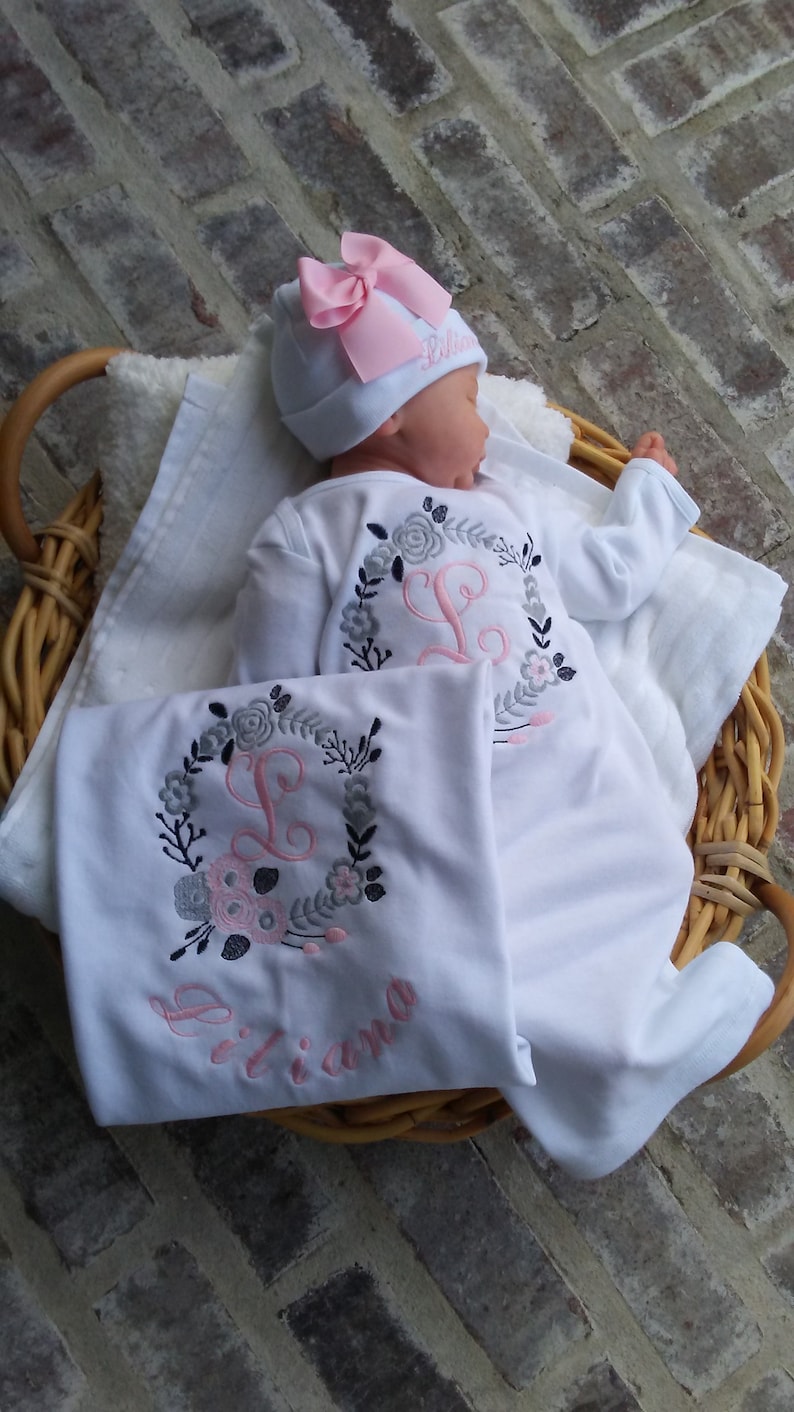 Baby Girl Coming Home outfit with options.  Beautifully embroidered floral wreath with initial, name on beanie, and blanket with wreath, initial and name under wreath.