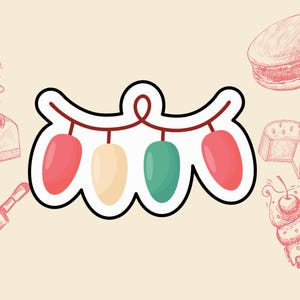 May include: A sticker featuring a string of colorful lights in red, cream, and green, with a black outline. The background includes sketches of baked goods like cake, a macaron, and a cupcake.