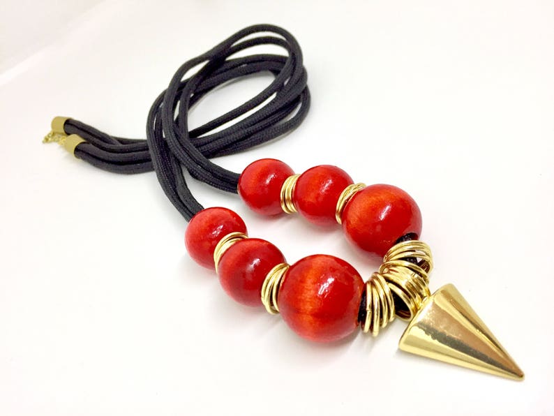 multi rings and Arrow head design Nylon Cord necklace with wood beads The Akan Collection
