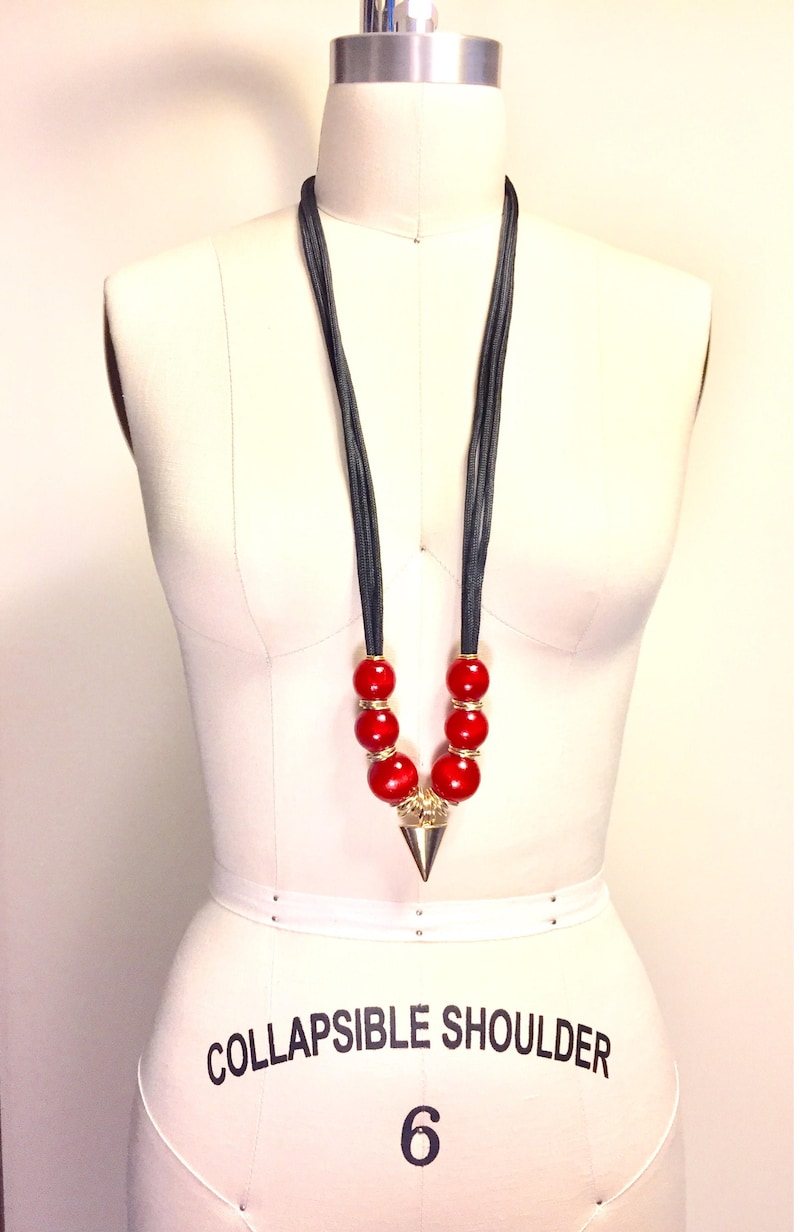 multi rings and Arrow head design Nylon Cord necklace with wood beads The Akan Collection