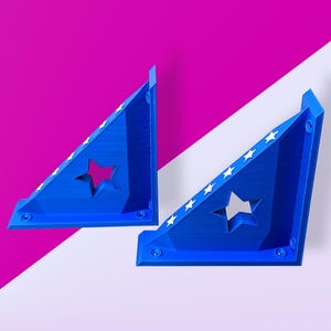 May include: Two blue plastic corner brackets with white star cutouts. The brackets are angled and have a decorative design.
