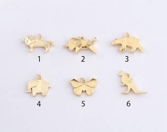May include: A collection of six gold-colored animal charms. The charms include a lion, tiger, bear, elephant, butterfly, and kangaroo. Each charm has a geometric, origami-like design and a small loop for attaching to jewelry.