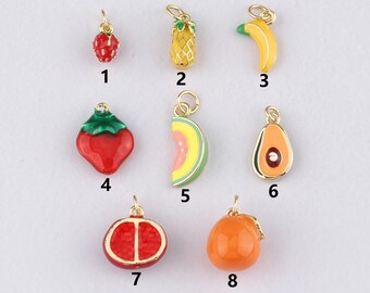 May include: A collection of eight colorful fruit charms, including a strawberry, pineapple, banana, and avocado. Each charm is detailed with vibrant enamel and gold-tone metal, perfect for jewelry making or crafting.