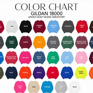 May include: A Gildan 18000 unisex heavy blend sweatshirt color chart featuring rows of small sweatshirt icons in various colors, each labeled with its specific color name, including Antique Cherry Red, Ash, Black, Cardinal Red, and many others.