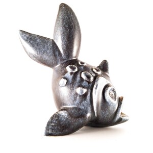 May include: A ceramic fish figurine with a glossy, speckled, dark blue and gray finish. The fish has a large, upright fin and a detailed face with an open mouth. The figurine is on a white background.