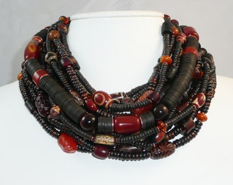 Zanzibar - multistrand necklace of agate, resin, bone, carnelian, horn and wood with copper accents