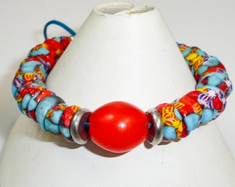 Sunshine bracelet - orange tomato bead, Ghanaian Krobo glass discs, hammered rhodium rondelles, stainless heishis and accents, sliding clasp