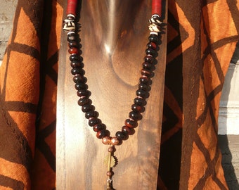 The Protector necklace - bronze pendant and Baule bead, brown agate, Batik bone discs, vulcanite discs and copper accents