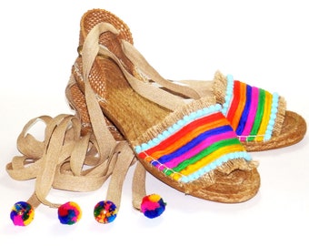 Rainbow flat espadrilles sandals made of jute fabric, and multicolored embellishments. Organic tissue. Alpargatas Made in Spain