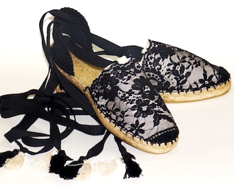 Lace up flat espadrilles with black lace trim. Beige canvas. Spanish traditional espadrilles. Organic cotton. Alpargatas made in Spain