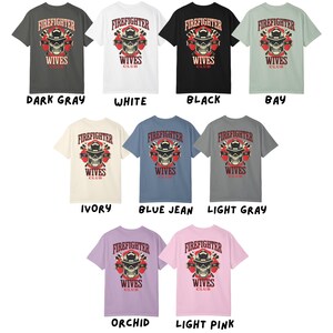 May include: A collection of short-sleeved t-shirts in various colors, each featuring a graphic with a firefighter skull design and the text "FIREFIGHTER WIVES CLUB". Colors include dark gray, white, black, bay, ivory, blue jean, light gray, orchid, and light pink.