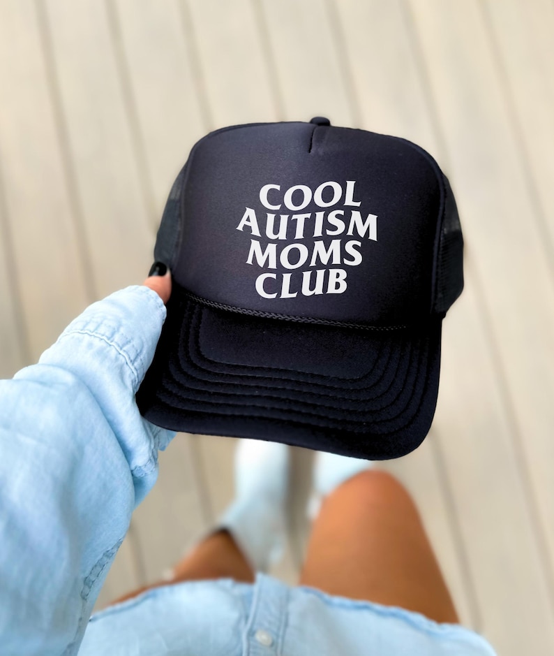 May include: Black trucker hat with white text that reads "COOL AUTISM MOMS CLUB".