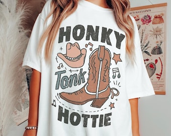 Camiseta com estampa "Honky Tonk Hottie", Camiseta moderna de cowgirl estilo country, Ideal para shows country, Estilo country, Camiseta de cowgirl, Estética alternativa, Camiseta ousada de rodeio