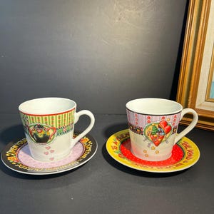 Pair Of MARY ENGELBREIT 2003 ENESCO Christmas Collectible Cup And Saucer