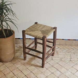 Small Moroccan stool made of wood and natural rope