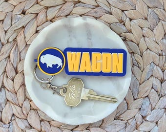 Llavero o etiqueta para bolso Buffalo Hockey Wagon / Robusto azul y amarillo