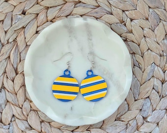 Pendientes circulares a rayas azules y amarillas de Buffalo Hockey