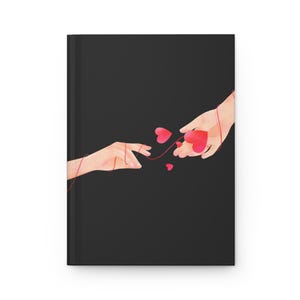 May include: Two hands connected by a red string with small red hearts floating around them. The background is black.